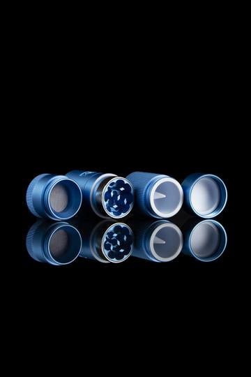 zam blue 1 inch herb grinder on a black background. Grinder is separated into different sections for easy view