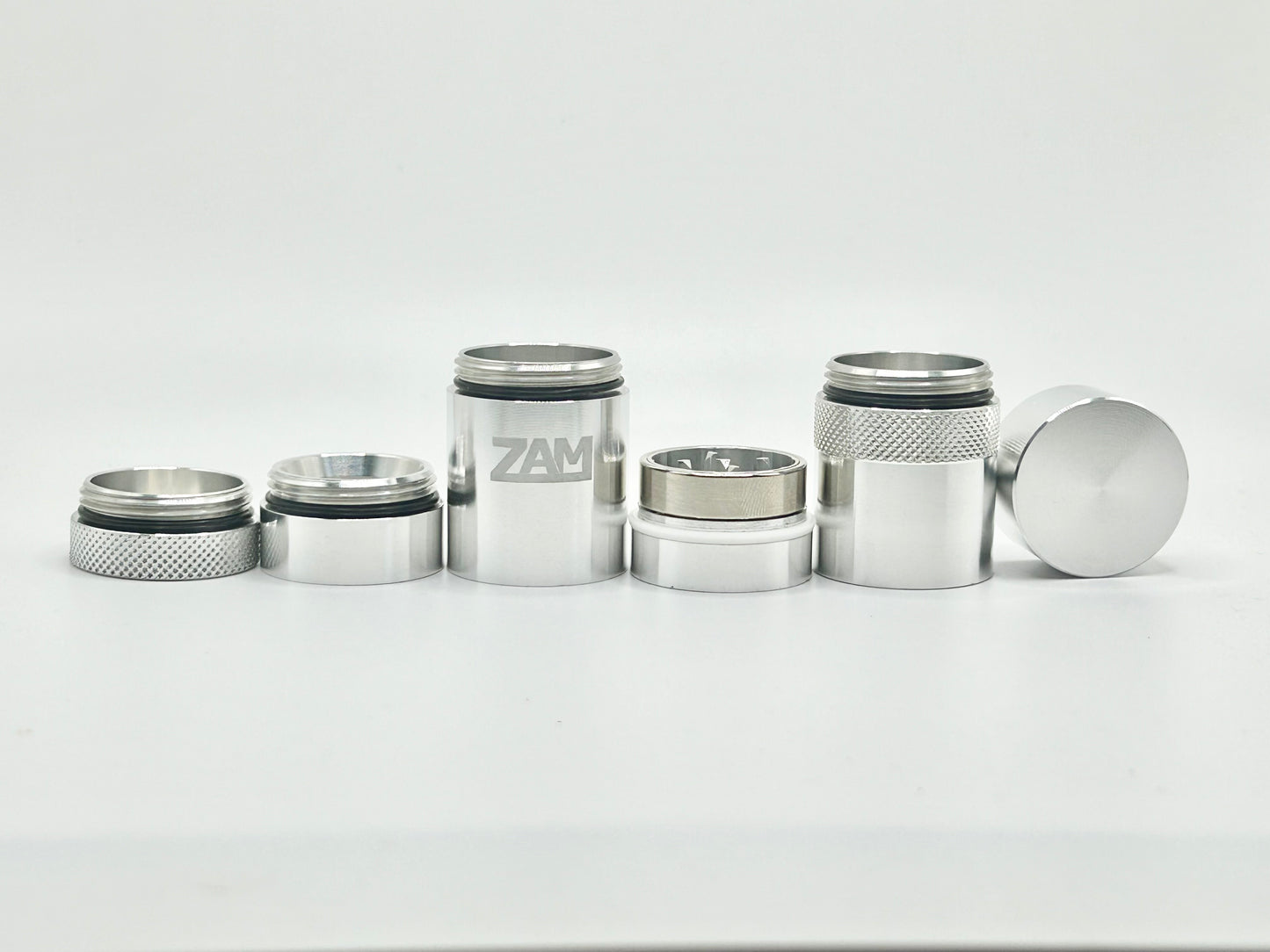 All the different sections of the pocket grinder lined up in a row