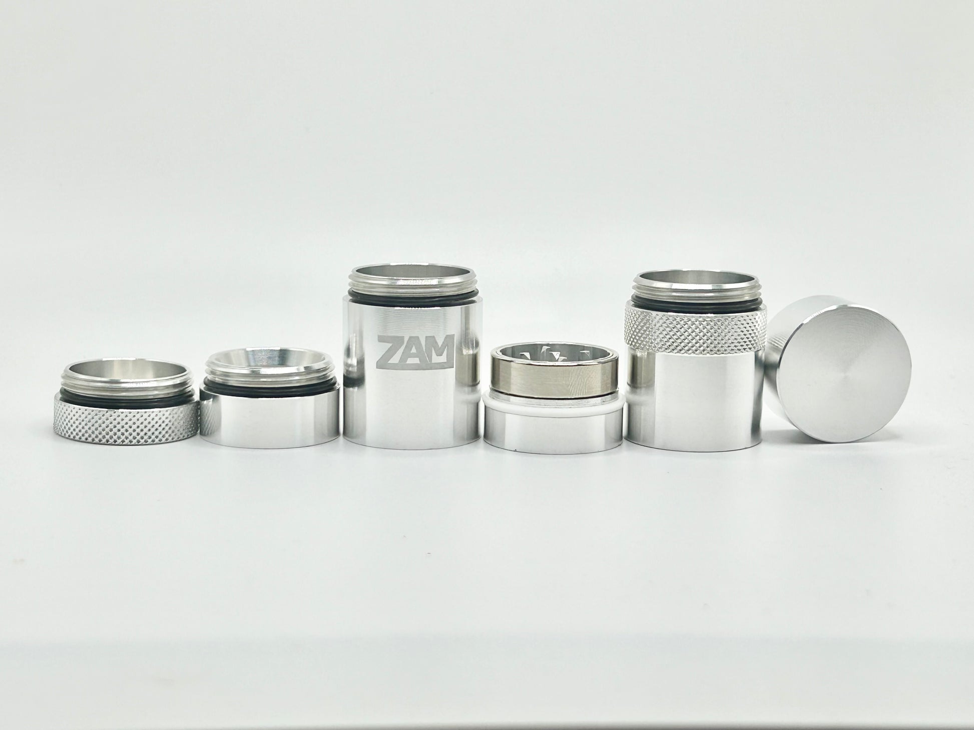All the different sections of the pocket grinder lined up in a row