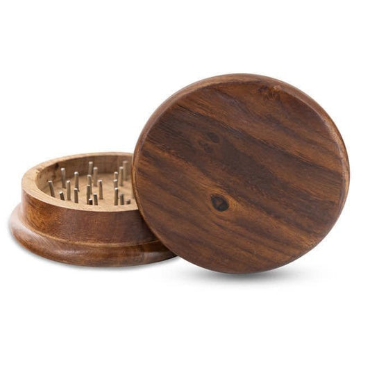 A wooden weed grinder with metal pins inside