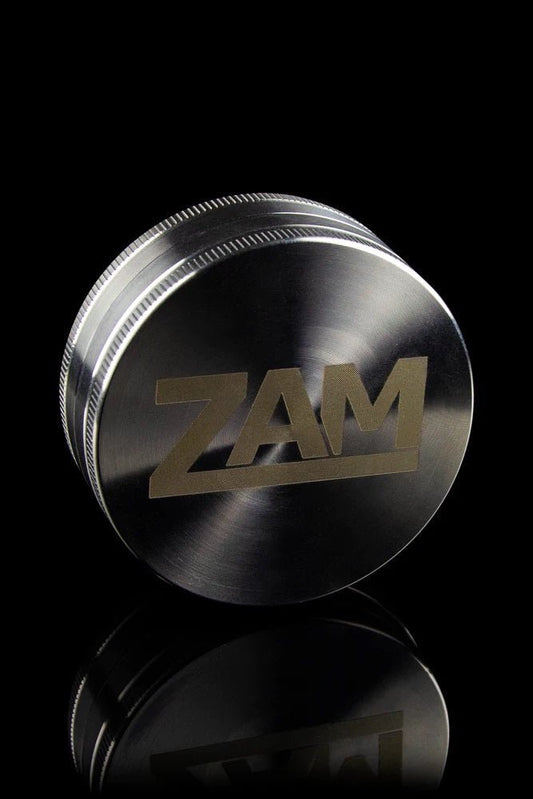 2.5" diameter 2 piece stainless steel grinder on a black background