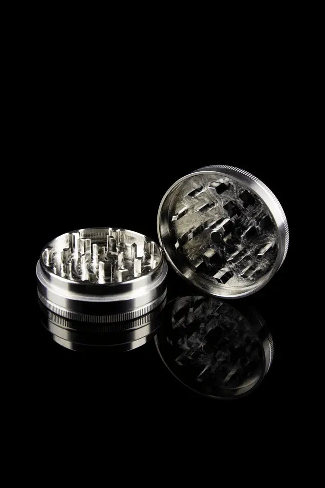 2 piece stainless steel grinder with lid off and chamber open