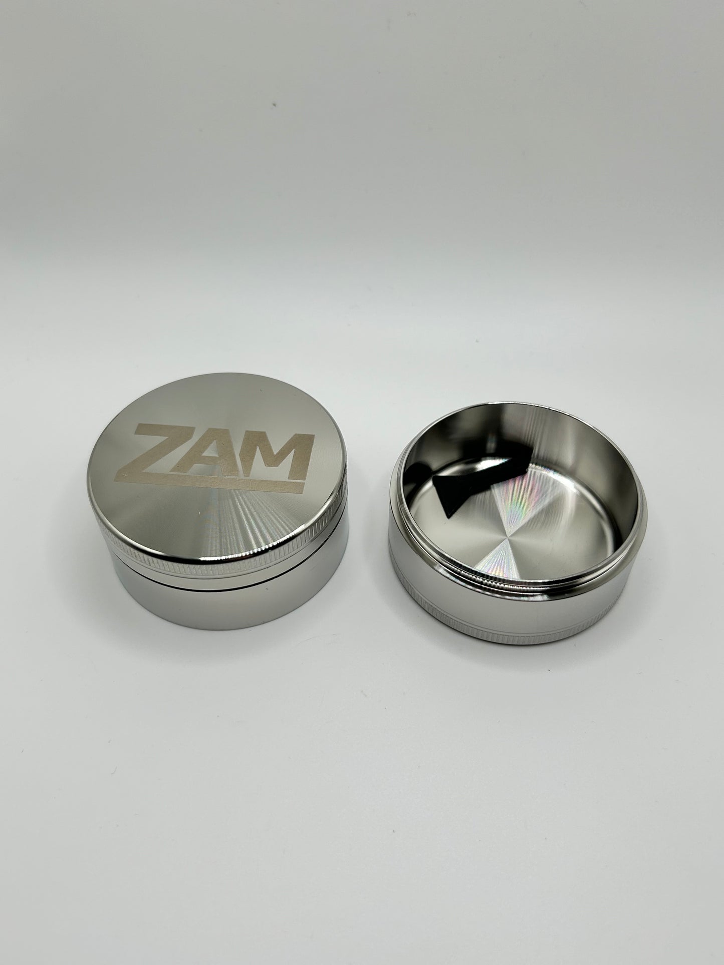 3 piece stainless steel grinder showing deep collection chamber
