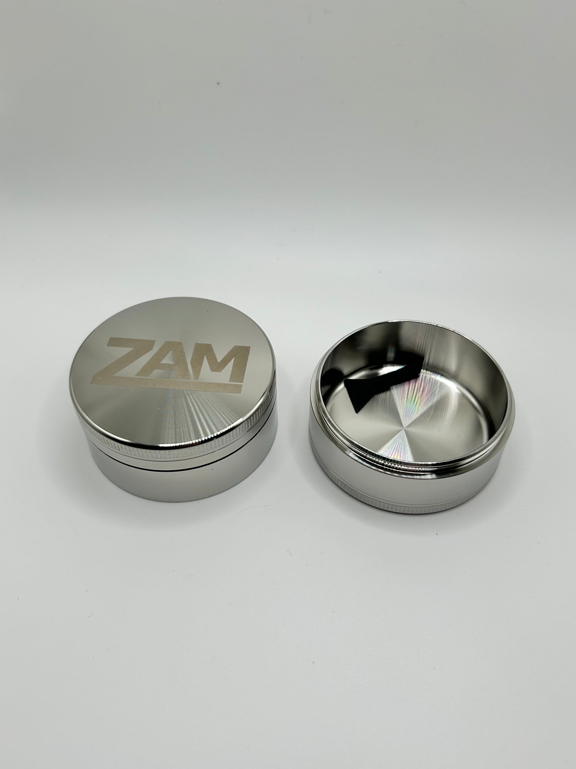 3 piece stainless steel grinder showing deep collection chamber