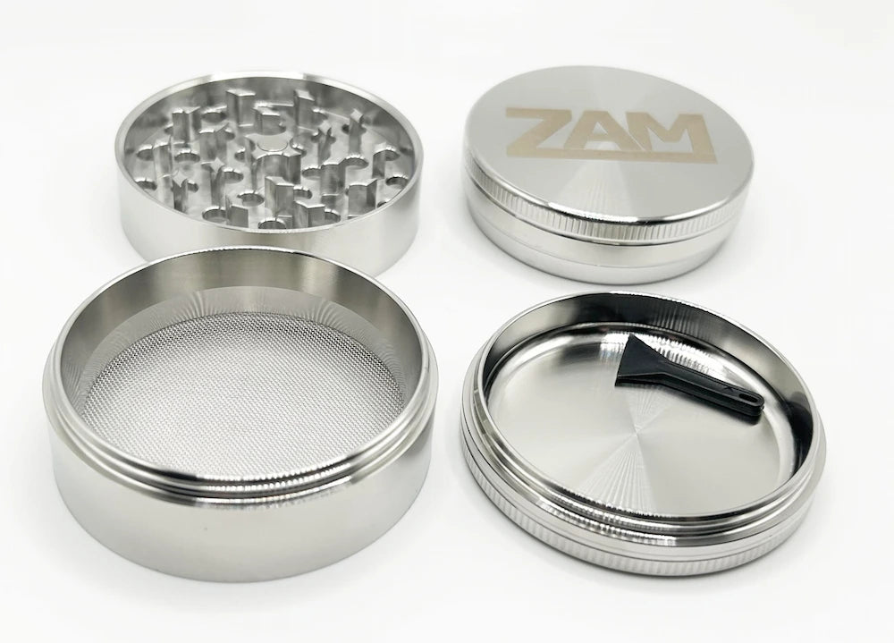 all sections of the big 4 piece stainless steel zam grinder. Focus on screen