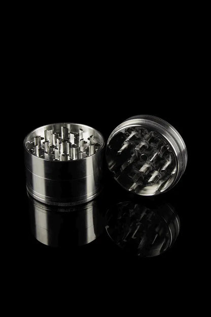 ZAM big 4 piece stainless steel grinder with a black background